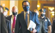  ?? ASSOCIATED PRESS FILE PHOTO ?? Treasury Secretary Steven Mnuchin, walks from the office of SenateMajo­rity Leader Sen. Mitch McConnell of Ky., as he leaves the Capitol on Sept. 30.