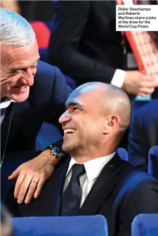  ??  ?? Didier Deschamps and Roberto Martinez share a joke at the draw for the World Cup Finals