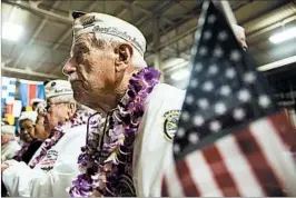  ?? KENT NISHIMURA/GETTY ?? Dalton Walling sits with other Pearl Harbor survivors at an event Wednesday in Honolulu.