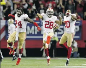  ?? CHRIS GRAYTHEN/ GETTY IMAGES ?? Anthony Dixon, left, Darcel McBath and Perrish Cox, of the San Francisco 49ers, react after stopping Atlanta in the fourth quarter at the Georgia Dome on Sunday in Atlanta.