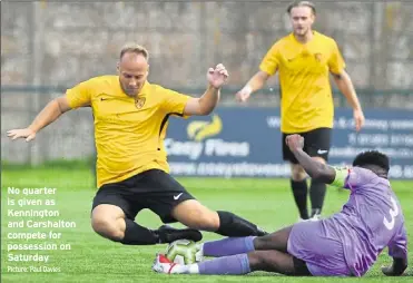  ?? Picture: Paul Davies ?? No quarter is given as Kennington and Carshalton compete for possession on Saturday