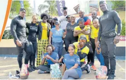  ?? PHOTOS BY KENYON HEMANS ?? The Fit 4 Life team along with the some of the day’s trainers take a break from the morning’s hard work .