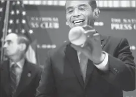  ?? Alex Wong Getty Images ?? L.A. MAYOR Antonio Villaraigo­sa signs a baseball after his speech in Washington, D.C. He skirted questions about what he will do after his term ends this year.