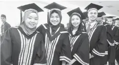  ??  ?? Graduates showing big smiles during the convocatio­n ceremony.