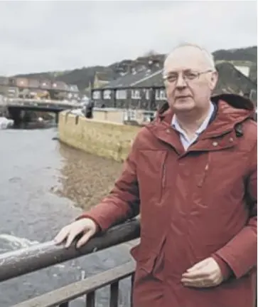  ??  ?? PRIORITY: Calderdale Council leader Tim Swift, pictured in storm-hit Mytholmroy­d, has urged the government to place the district on a Tier 1 priority during the Budget meeting to better tackle flooding