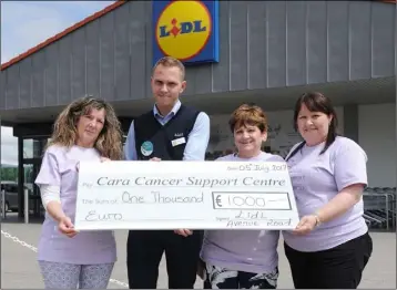  ??  ?? Lidl make a donation to the Dundalk Cara Caner Support Centre.