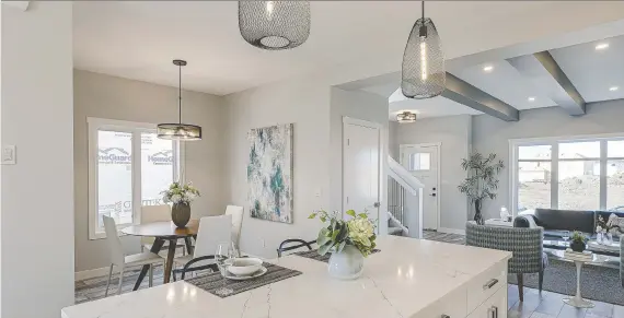  ?? SCOTT PROKOP ?? This two-storey, 1,547-square-foot show home features a seven-foot quartz-topped island and a modern, open layout with a defined space for the dining room.