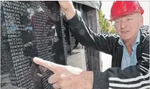  ?? CLIFFORD SKARSTEDT EXAMINER ?? Wall of Honour founder David Edgerton points to the name of his deseased father John Edgerton, a Second World War veteran.