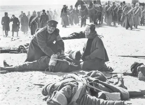  ?? PNG MERLIN ARCHIVE ?? Omar Sharif, left, and Julie Christie in Doctor Zhivago. The 1965 film is based on Boris Pasternak’s like-named novel and won five Academy Awards. Yet the love story that inspired it has never been fully explored before.