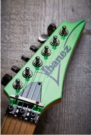  ?? ?? The pointed-profile Ibanez headstock of the JEM777 was a move away from the Gibson-inspired designs that came before it. Note the body-matching Loch Ness Green finish