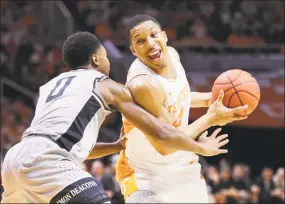  ?? Donald Page / Getty Images ?? Wake Forest’s Brandon Childress, left, guards Tennessee’s Grant Williams during Saturday’s contest.