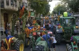  ?? SAMUEL ARANDA, NEW YORK TIMES ?? Farmers from around Catalonia parade in Barcelona in support of the Catalonia referendum and vow to help protect polling stations in the upcoming vote.