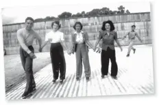  ??  ?? Left: Ruby Abbott, second from left, and friends enjoy a day at the ice skating rink on Hawaii’s North Shore. Concerns about a Japanese invasion prompted the U.S. Navy to enclose Waikiki Beach with barbed wire, pile sandbags against residences and...