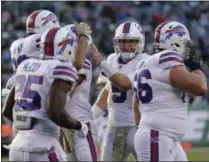 ?? SETH WENIG - THE ASSOCIATED PRESS ?? Buffalo Bills quarterbac­k Matt Barkley (5) celebrates with teammates after the Bills scored a touchdown against the New York Jets during the third quarter of an NFL football game, Sunday, Nov. 11, 2018, in East Rutherford, N.J.