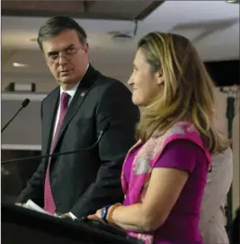 ?? The Canadian Press ?? Mexico’s Secretary-designate of foreign affairs Marcelo Ebrard looks towards Canada’s Minister of Foreign Affairs Chrystia Freeland during a news conference following a meeting in Ottawa on Monday.