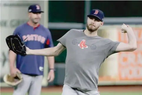  ?? FRANK FRANKLIN II/AP ?? Chris Sale threw a bullpen session Saturday and was confirmed as the Red Sox’ starter for Game 1 of the World Series on Tuesday.