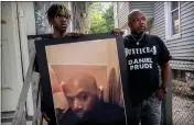  ?? TED SHAFFREY — THE ASSOCIATED PRESS FILE ?? Armin Prude, left, and Joe Prude hold an enlarged photo of Daniel Prude on Sept. 3, 2020, in Rochester, N.Y.