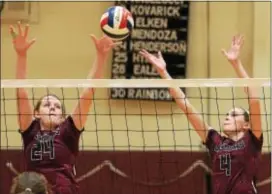  ?? PETE BANNAN — DIGITAL FIRST MEDIA ?? Garnet Valley’s Sam Mann, left, and during their match with Conestoga. Erin Patterson rise for the block