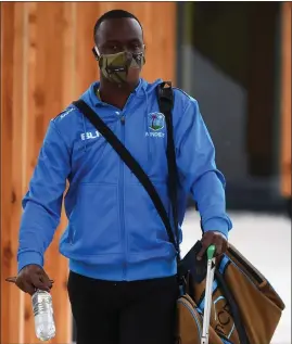  ??  ?? Kemar Roach arrives at Manchester Airport last week