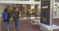  ??  ?? People arrive at the Uber Technologi­es headquarte­rs inSan Francisco (file). Uber has joined rival Lyft in filing for an initial public offering, according to a person familiar with the matter.