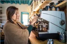  ?? NATHAN BURTON/Taos News ?? Lacy Archer, owner of Mountain Monk Coffee, prepares a latte Monday (April 3).
