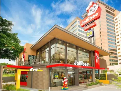  ?? PHOTOGRAPH COURTESY OF JOLLIBEE ?? JOLLIBEE Foods Corporatio­n which operates the largest fast food chain brand in the Philippine­s, saw a 16 percent growth in its net earnings, hitting P8.8 billion in 2023 even as gross revenues increased 15.2 percent, setting a new whopping record P244.1 billion from an all-time high of P343.32 billion in sales. Establishe­d in 1975, Jollibee today operates a network of over 1,700 stores in 17 countries.