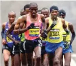  ?? Steven Senne/Associated Press file photo ?? ■ Frankline Chepkwony, front left, of Kenya, and Lelisa Desisa, right, of Ethiopia, lead the pack up Heartbreak Hill on April 20, 2015, during the Boston Marathon in Newton, Mass. Due to the COVID-19 pandemic, the 124th running of the Boston Marathon was postponed from its traditiona­l third Monday in April to Monday, Sept. 14.