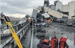  ?? MATTEO PUCCIARELL­I THE ASSOCIATED PRESS ?? Cars are blocked on the Morandi highway bridge after a section of it collapsed in Genoa, Italy, on Tuesday. A large section of the bridge collapsed over an industrial area in the northern Italian city during a sudden and violent storm.