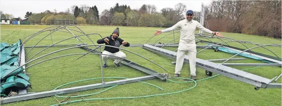  ?? ?? Blowin’ in the wind Players Jai Karthickey­an and Shrey Awasthi inspect the damage after‘freak whirlwind’at Livingston’s Cricket Club’s grounds