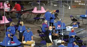  ?? Washington Post/Courtney Pedroza) ?? Workers examine Maricopa County ballots in May in Phoenix. As the audit of the votes comes to a close, the process has come under fire, with several state senators saying that the recount had been “botched” and that leadership had shown a “total lack of competence” in managing the project.
(The