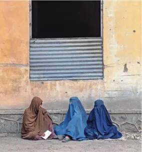  ?? Afghanista­n. EBRAHIM NOROOZI/AP FILE ?? Afghan women wait to receive food rations from a humanitari­an aid group Tuesday in Kabul, Afghanista­n. Two top internatio­nal rights groups on Friday slammed the severe restrictio­ns imposed on women and girls by the Taliban in