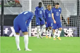  ?? - AFP photo ?? Chelsea players react as Wolves score second goal during the English Premier League football match at the Molineux stadium in Wolverhamp­ton, central England.