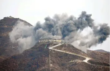  ?? — AFP ?? This general view shows an explosion as part of the dismantlem­ent at a South Korean guard post in the Demilitari­zed Zone (DMZ) dividing the two Koreas in Cheorwon as a North Korean guard post is seen.