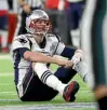  ?? GETTY IMAGES ?? Tom Brady sits dejectedly after fumbling the ball during the fourth quarter.