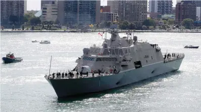  ?? The Associated Press ?? The USS Detroit, a Freedom-class of littoral combat ship, arrives Friday, Oct. 14, 2016, in Detroit. The Navy that once wanted smaller, speedy warships to chase down pirates has made a speedy pivot to Russia and China and many of those ships, like the USS Detroit, could be retired. The Navy wants to decommissi­on nine ships in the Freedom-class, warships that cost about $4.5 billion to build.