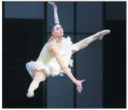  ??  ?? LYUBOV ANDREYEVA leaps hugely as she holds gravity defying poses like an accomplish­ed aerialist.