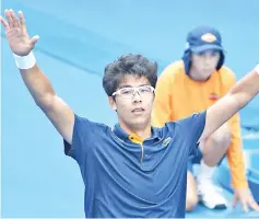  ?? — AFP photo ?? South Korea's Hyeon Chung celebrates beating Germany's Alexander Zverev in their men's singles third round match on day six of the Australian Open tennis tournament in Melbourne on January 20, 2018.