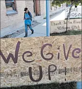  ?? RICK BOWMER/AP ?? A man walks past a “we give up” sign outside Euro Treasures Antiques on Friday in Salt Lake City, where the proprietor is closing his art and antique store after 40 years.