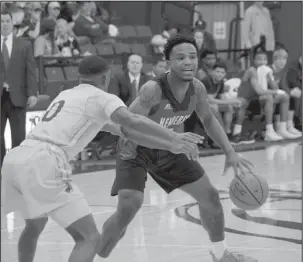  ?? Submitted photo ?? TAPPIN OUT: Henderson State senior guard Kaylon Tappin, back, runs the Reddies’ offense Thursday against Draylan Perkins and the Southern Arkansas Muleriders in Magnolia. After the 79-68 loss eliminated Henderson from qualifying for the GAC Tournament,...