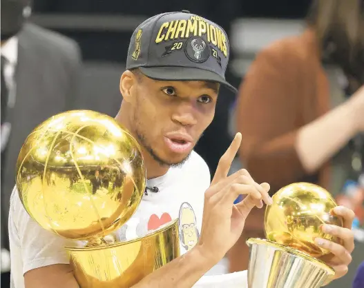  ?? JUSTIN CASTERLINE/GETTY ?? Giannis Antetokoun­mpo and the Bucks have their sights set on winning a second straight NBA championsh­ip.