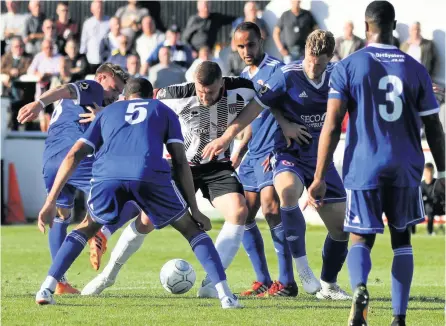  ??  ?? Frontman Ryan Brunt is surrounded by Welling United defenders, who put in a steadfast display to blank the Romans Saturday afternoon PICTURES: Simon Howe