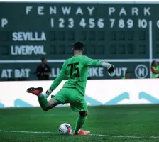  ?? NANCY LANE / BOSTON HERALD ?? A DIFFERENT LOOK: Liverpool’s Andy Lonergan takes a goal kick in front of the Green Monster last night.