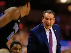  ?? File photo ?? After beating Kansas last week, Mike Krzyzewski,
right, and Duke moved up to No. 1 in the AP men’s college basketball poll. Providence, which won both of its games last week, is ranked 31st. The Friars travel to struggling Northweste­rn Wednesday.