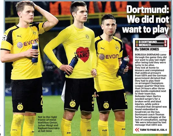  ??  ?? Not in the right frame of mind: Matthias Ginter, Julian Weigl and Raphael Guerreiro at full-time