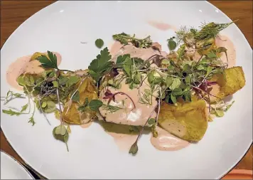  ??  ?? Above, at left, trout fillet with potatoes, shaved Brussels sprouts and mustard cream. At right, golden beet salad nods to a Thai preparatio­n with peanuts, herbs and brown-sugar vinaigrett­e.