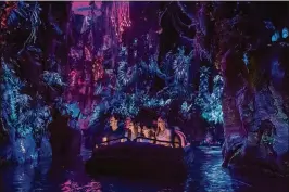  ?? DISNEY PHOTO BY STEVEN DIAZ ?? Pandora — The World of Avatar: New attraction­s include the family-friendly Na’vi River Journey. The adventure begins as guests sail in reed boats down a mysterious, sacred river hidden within the biolumines­cent rainforest.