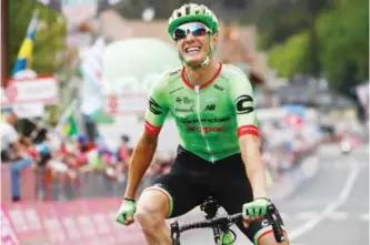  ?? — AFP ?? CANAZEI: France’s Pierre Rolland of team Cannondale-Drapac celebrates as he crosses the finish line to win the 17th stage of the 100th Giro d’Italia, Tour of Italy, cycling race from Tirano to Canazei yesterday.