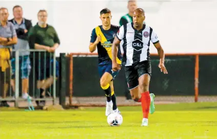  ?? ?? Adrian Clifton in action against Altrincham on August 16. Photo credit: Darren Woolley