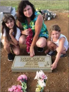  ?? COURTESY OF REX CRUM ?? The author’s daughter, Madeline Crum, left, wife Megan Crum and daughter Lily Crum at the grave of Megan’s paternal grandmothe­r in Naalehu, Hawaii.