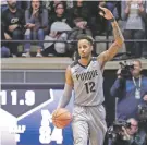  ?? MICHAEL CONROY/THE ASSOCIATED PRESS ?? Purdue forward Vincent Edwards celebrates as the team beats Michigan, 92-88, on Thursday in West Lafayette, Ind.